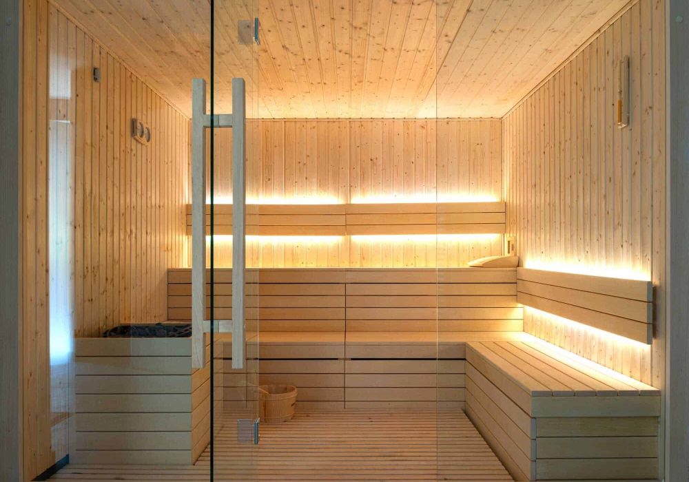 Front view of empty Finnish sauna room. Modern interior of wooden spa cabin with dry steam